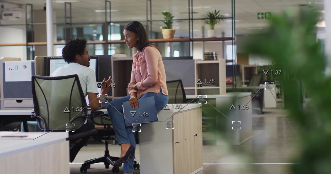 Colleagues Collaborating in Modern Office with Digital Financial Data Overlay