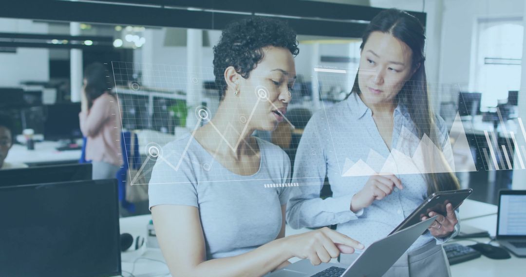 Diverse Business Colleagues Analyzing Financial Data in Office Environment