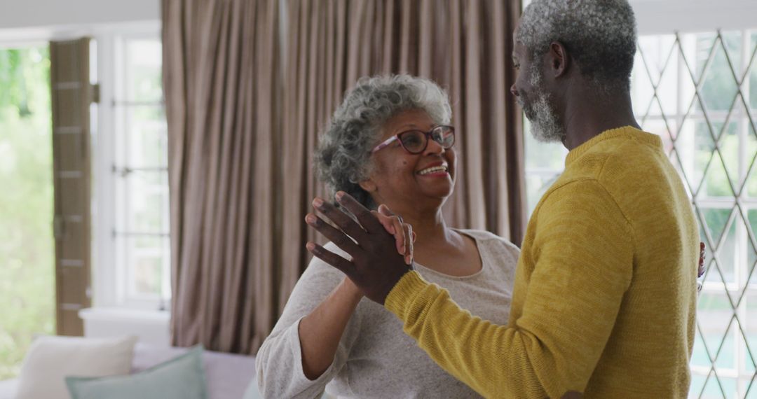 Elderly Couple Dancing Together in Living Room - Free Images, Stock Photos and Pictures on Pikwizard.com