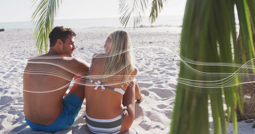 Couple Relaxing on Tropical Beach with Ocean View