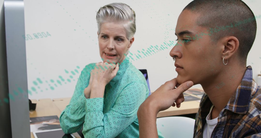 Focused Coworkers Collaborating on Data Analysis in Modern Office