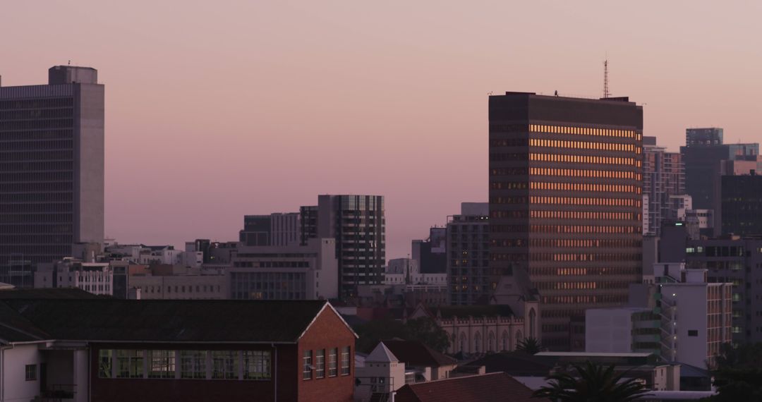 Skyscrapers at Dusk with Reflection on Windows Creating City Vibe