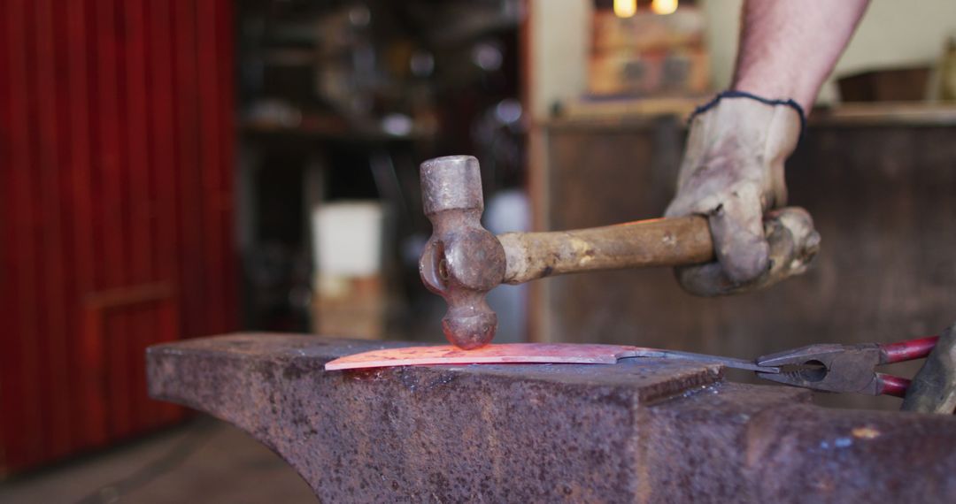 Blacksmith Hammering Hot Metal on Anvil in Workshop Closeup - Free Images, Stock Photos and Pictures on Pikwizard.com