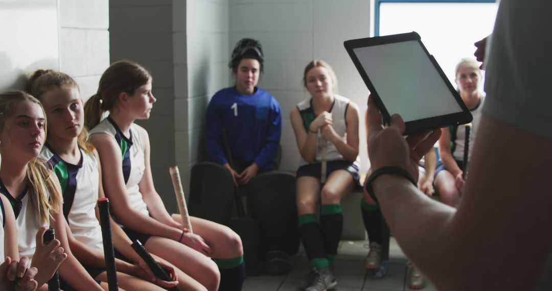 Female Field Hockey Team Receiving Strategy Tutorial in Locker Room - Free Images, Stock Photos and Pictures on Pikwizard.com