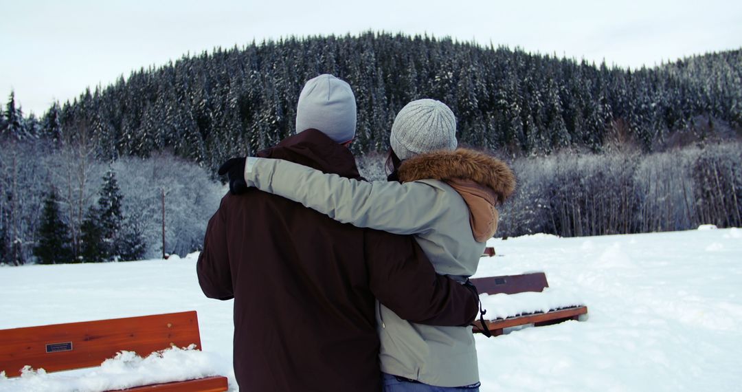 Couple Embracing in Winter Snowy Landscape - Free Images, Stock Photos and Pictures on Pikwizard.com