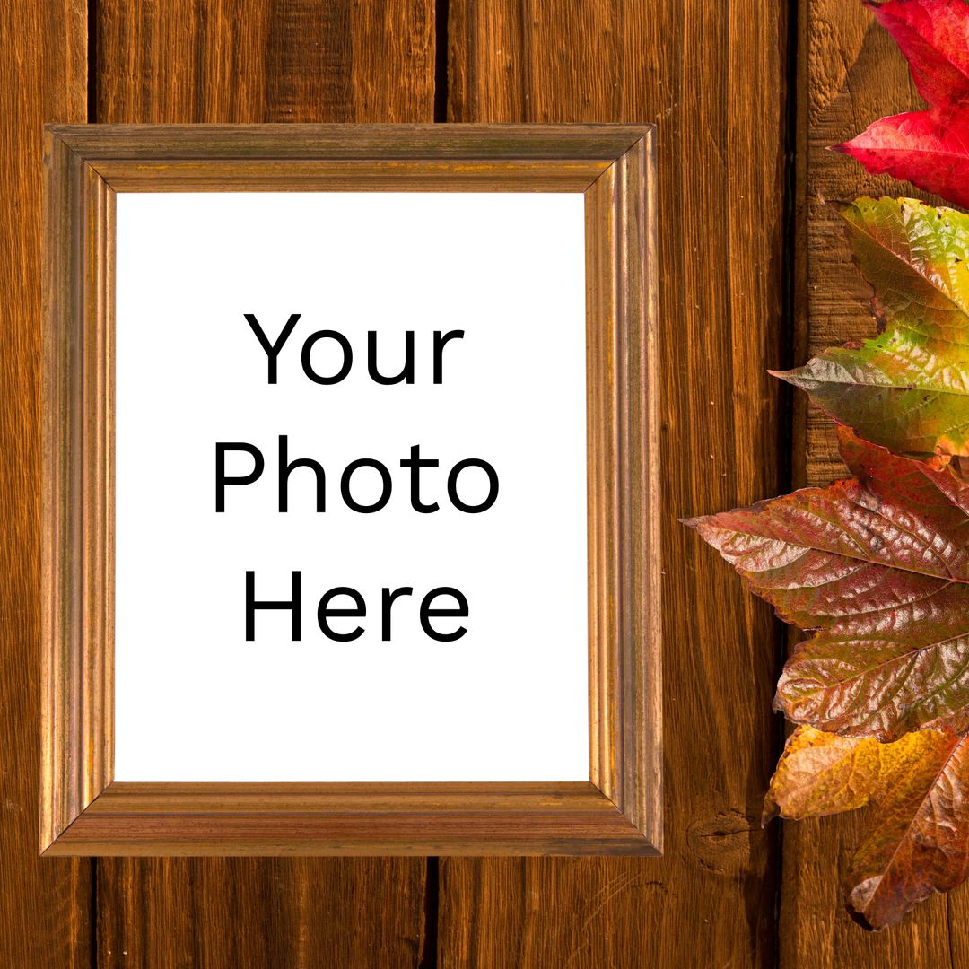 Blank Photo Frame with Autumn Leaves on Wooden Surface