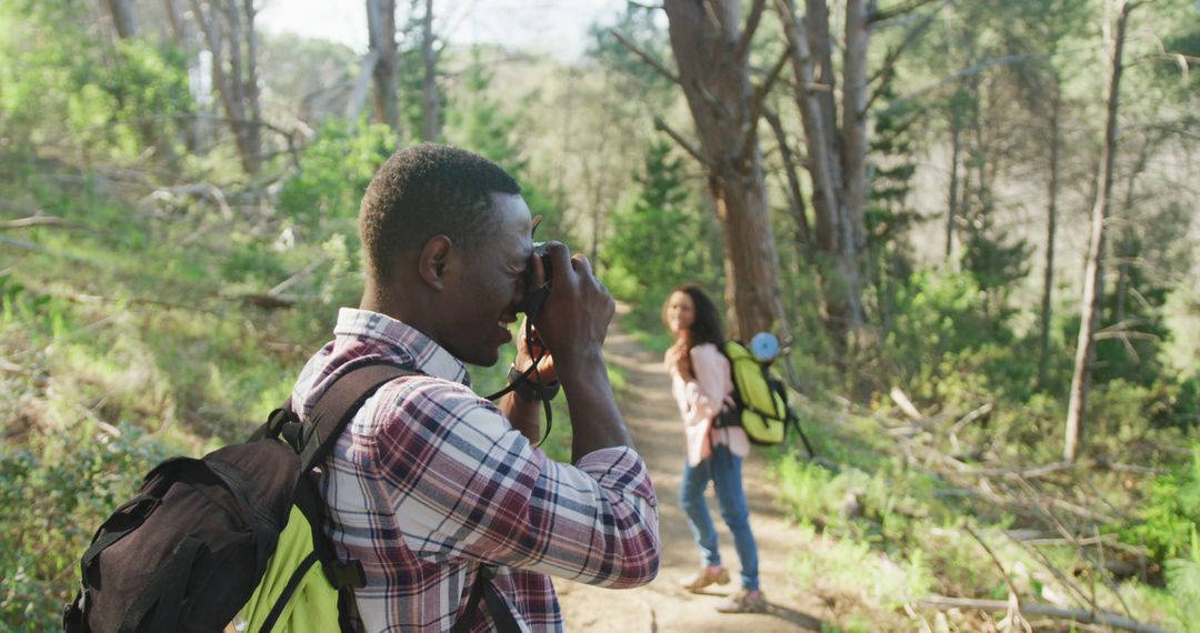 Diverse Couple Enjoying Nature and Photography During Hike