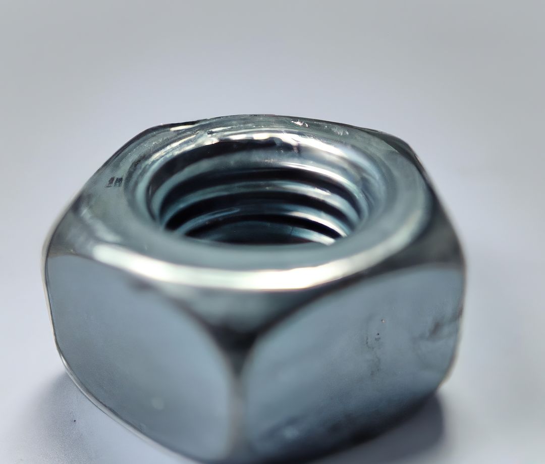 Close-Up of Metallic Hex Nut on White Background - Free Images, Stock Photos and Pictures on Pikwizard.com