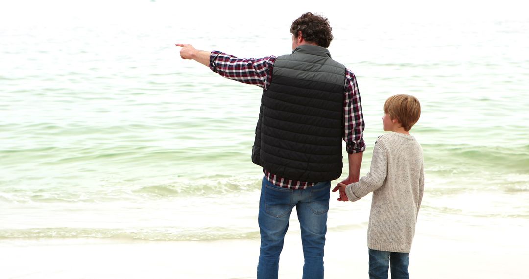 Father and Son Enjoying Beach, Holding Hands - Free Images, Stock Photos and Pictures on Pikwizard.com