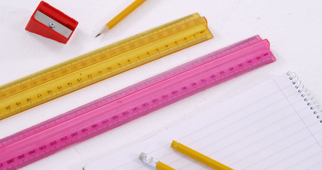 Colorful School Supplies with Yellow and Pink Rulers on White Table - Free Images, Stock Photos and Pictures on Pikwizard.com