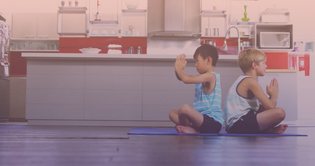 Young Brothers Practicing Yoga Together at Home