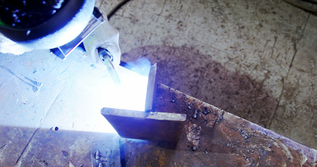 Welder at Work in Industrial Workshop with Welding Torch - Free Images, Stock Photos and Pictures on Pikwizard.com