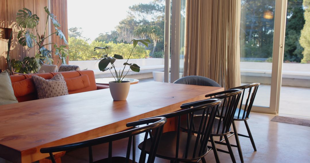 Modern Dining Area with Wooden Table and Black Chairs