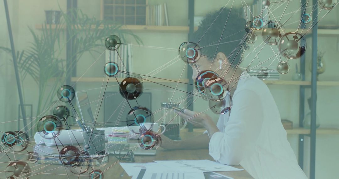 Woman Analyzing Global Technology while Working at Desk