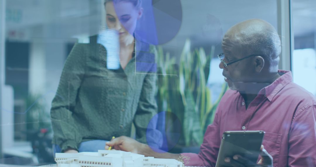 Diverse Coworkers Discussing Business Plan with Digital Overlay