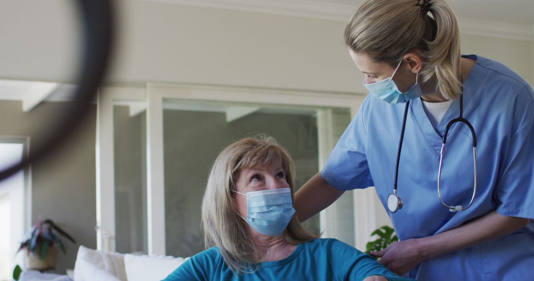 Healthcare Worker Assisting Elderly Woman During Home Visit - Free Images, Stock Photos and Pictures on Pikwizard.com