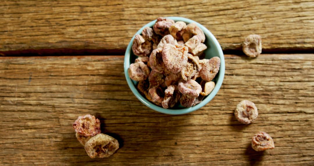 Dried Figs in Blue Bowl on Wooden Table - Free Images, Stock Photos and Pictures on Pikwizard.com