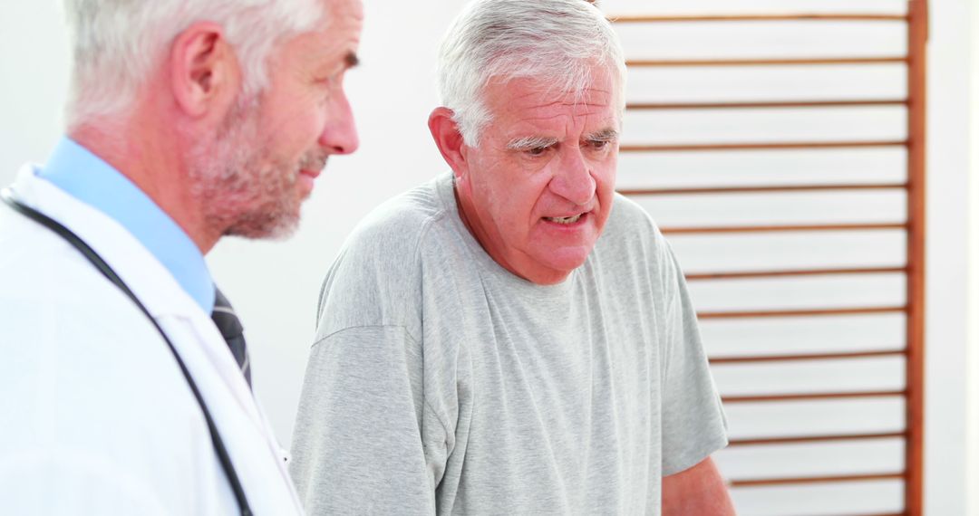 Senior Man Undergoing Physical Therapy with Doctor - Free Images, Stock Photos and Pictures on Pikwizard.com