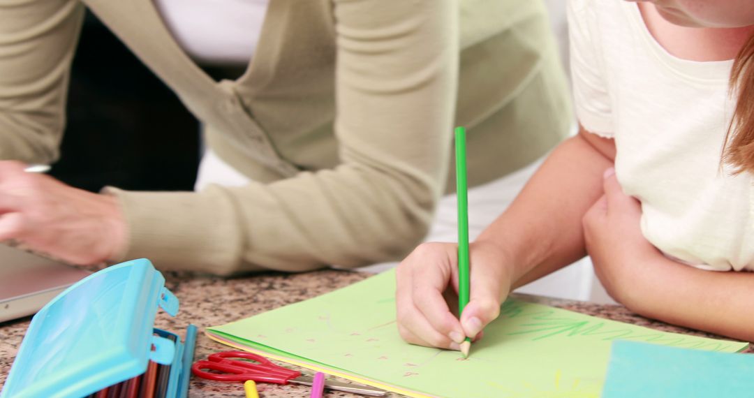 Young Child Drawing in Educational Environment with Mentorship
