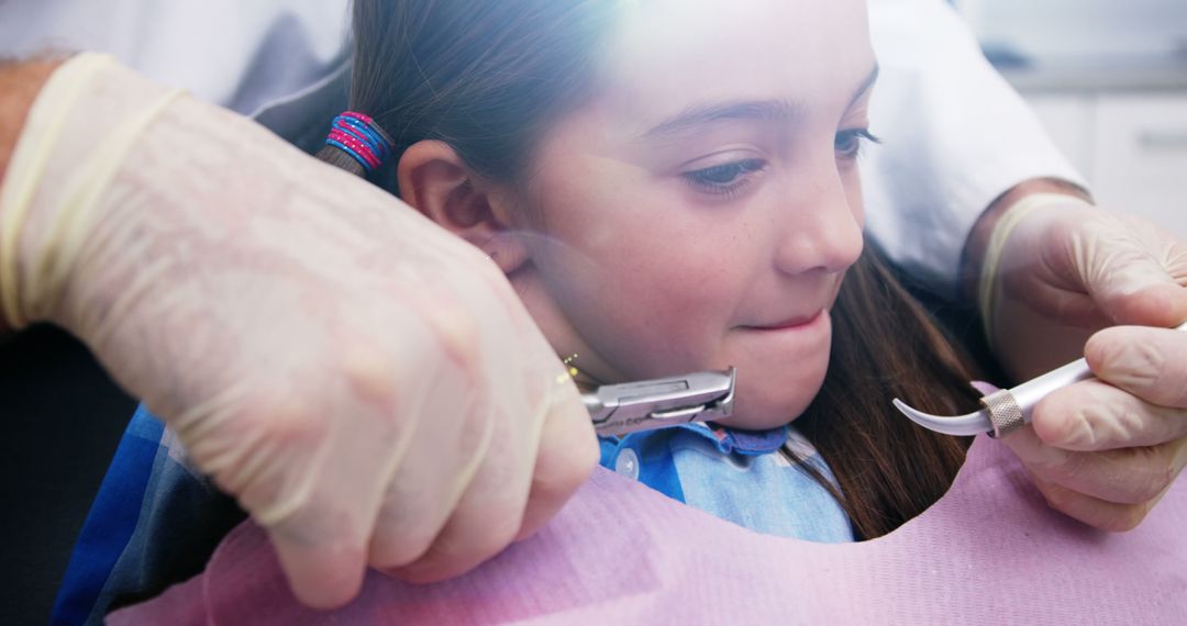 Young Girl Receiving Dental Checkup at Clinic - Free Images, Stock Photos and Pictures on Pikwizard.com