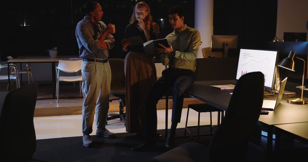 Diverse Business Team Analyzing Data in Late-Night Meeting