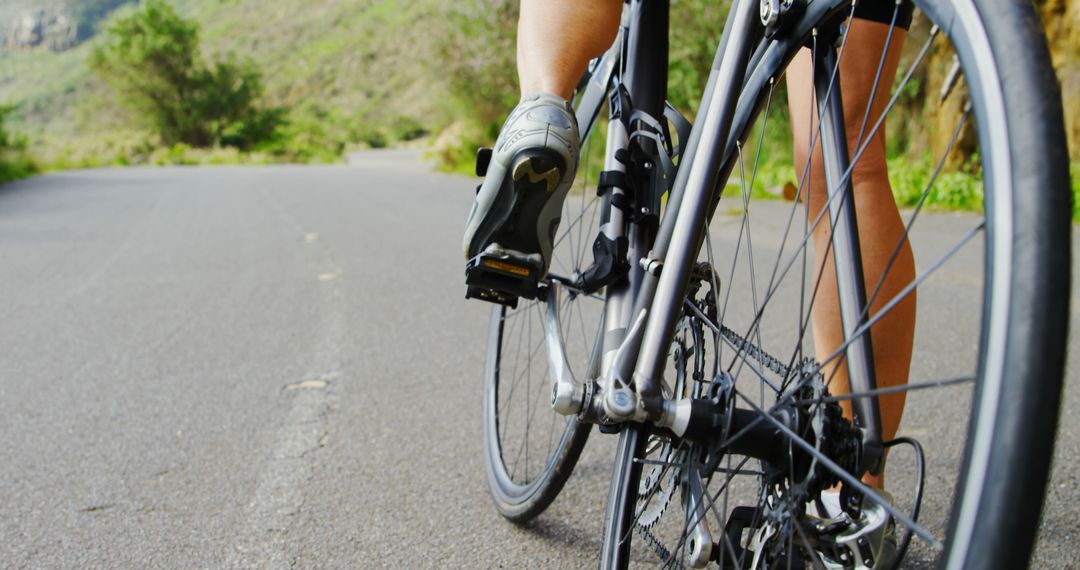 Cyclist Riding on Mountain Road in Summer - Free Images, Stock Photos and Pictures on Pikwizard.com