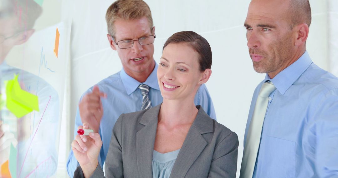 Focused Team Discussing Strategy in Modern Office