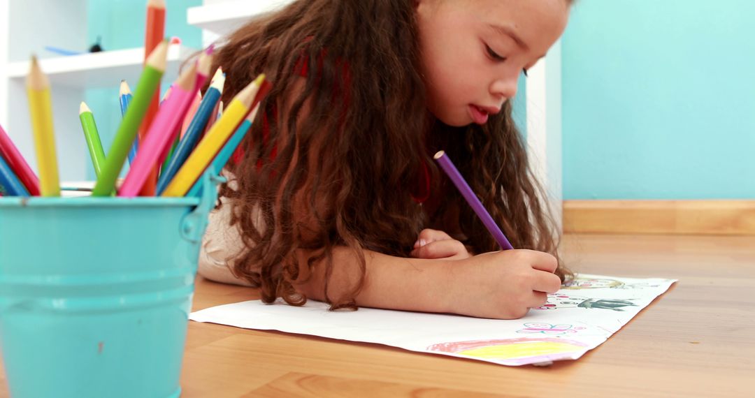 Little Girl Drawing with Colored Pencils on Floor - Free Images, Stock Photos and Pictures on Pikwizard.com