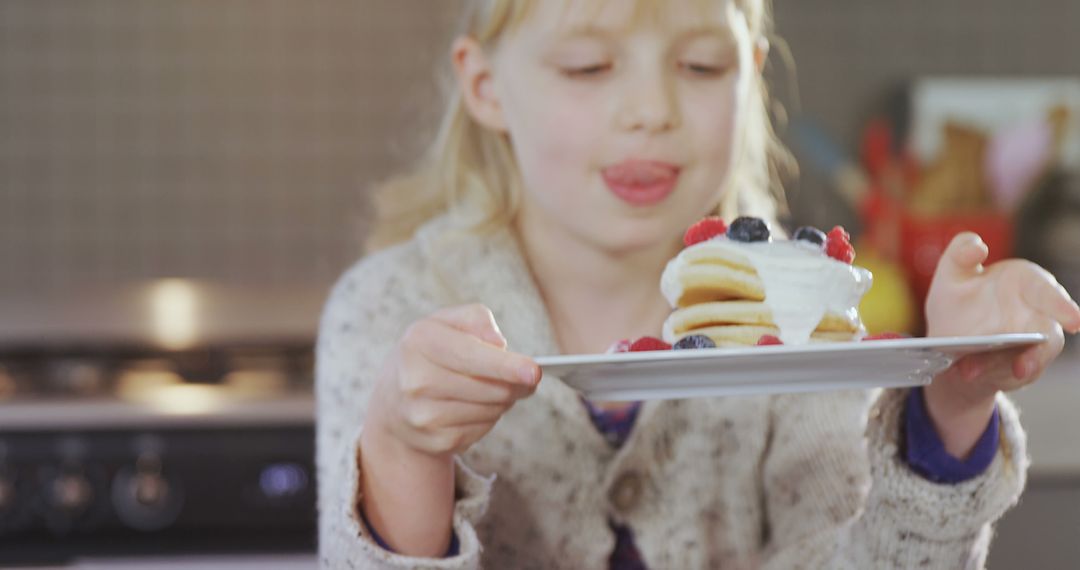 Young Girl Ready to Enjoy Stack of Fluffy Pancakes with Berries and Cream - Free Images, Stock Photos and Pictures on Pikwizard.com