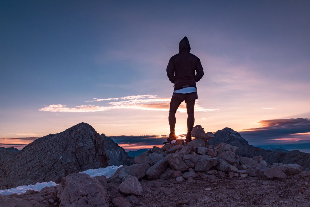 Silhouette of Hiker Standing on Mountain Peak at Sunset - Free Images, Stock Photos and Pictures on Pikwizard.com