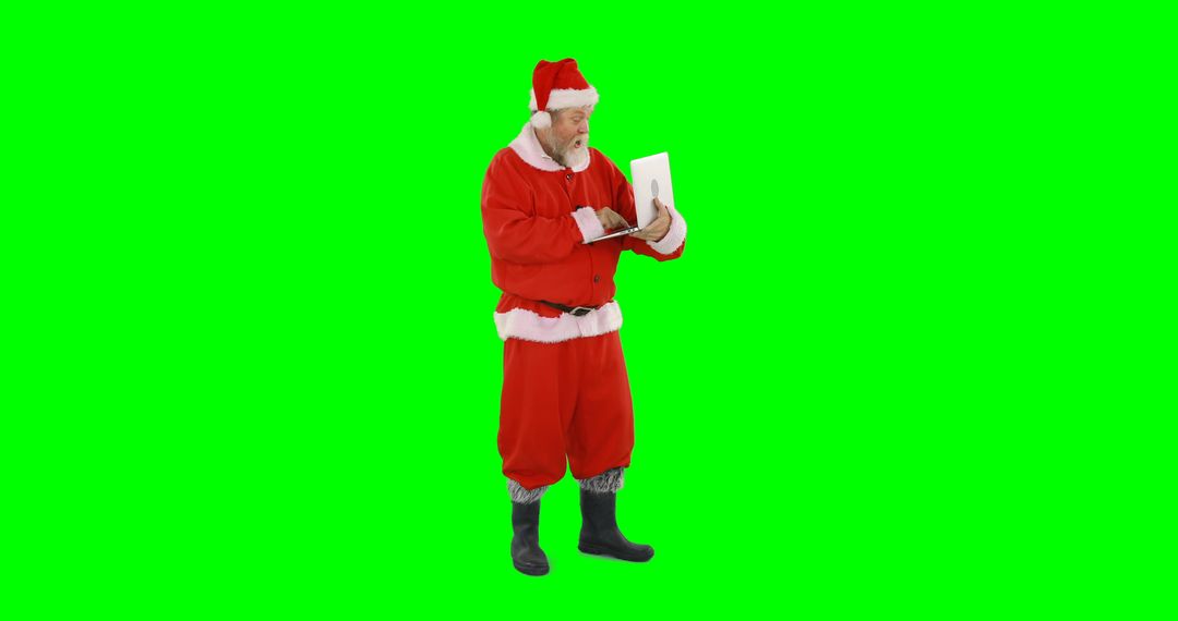 Santa Claus Using Laptop on Green Chroma Key Background - Free Images, Stock Photos and Pictures on Pikwizard.com