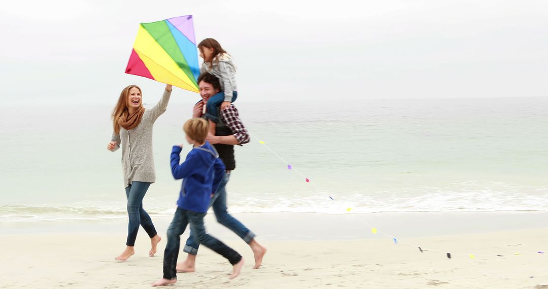 Family Flying Colorful Kite on Beach - Free Images, Stock Photos and Pictures on Pikwizard.com