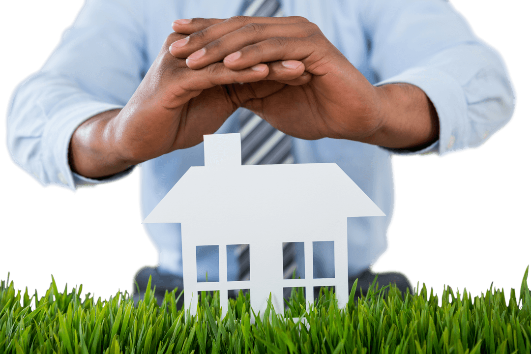 Transparent Paper House Protected by Hands Over Grass