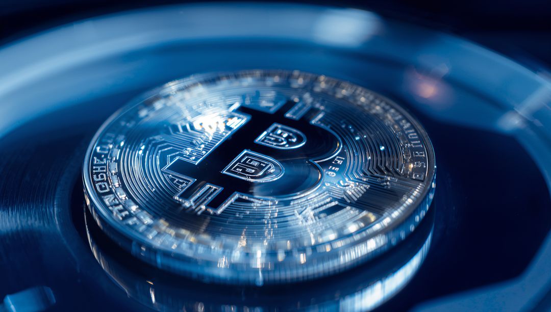 Close-up Shimmering Bitcoin Coin with Circuit Design