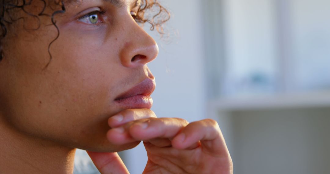 Pensive Graphic Designer Contemplating Creative Project