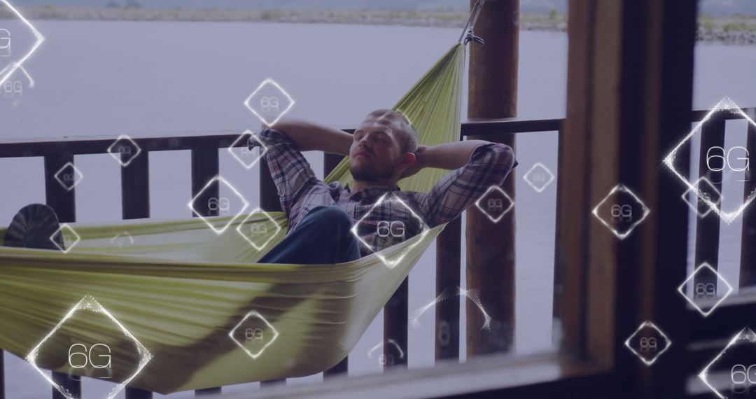 Relaxed Man Exploring 6G Technology in a Lakeside Hammock