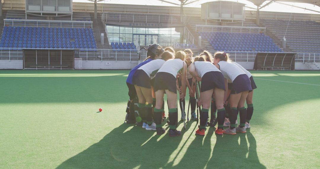 Field Hockey Team Huddling on Green Turf Before Game - Free Images, Stock Photos and Pictures on Pikwizard.com