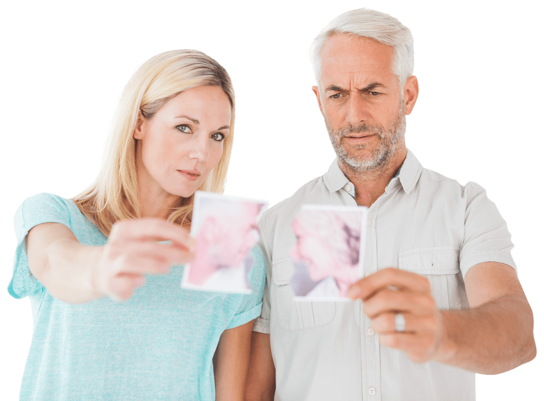 Unhappy Couple Holding Torn Photograph with Transparent Background