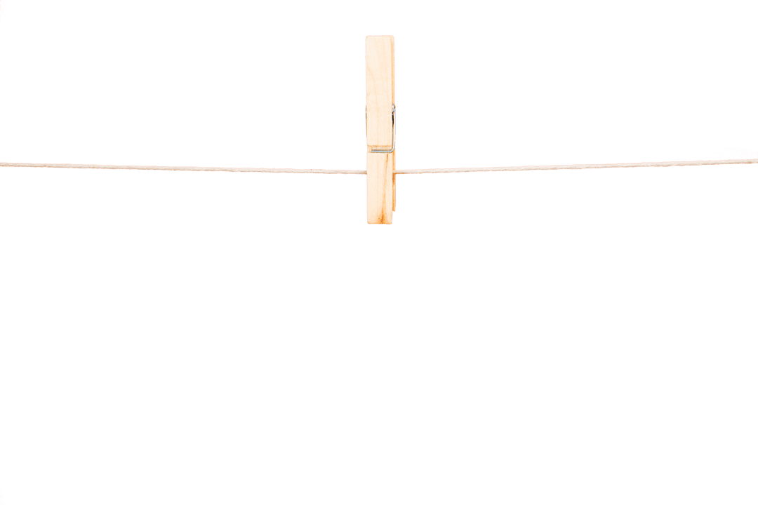 Single Clothespin Hanging on Transparent Wire