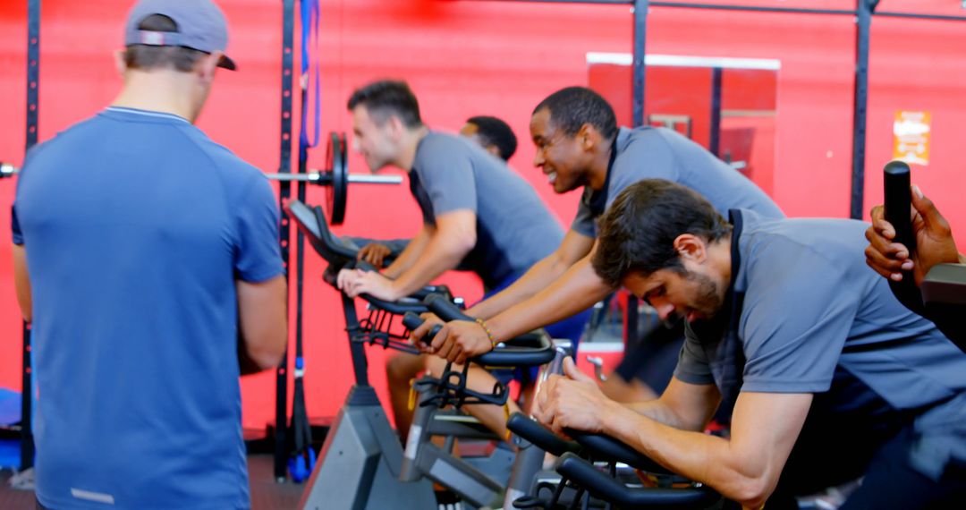 Group of Men Exercising on Spin Bikes in Gym - Free Images, Stock Photos and Pictures on Pikwizard.com