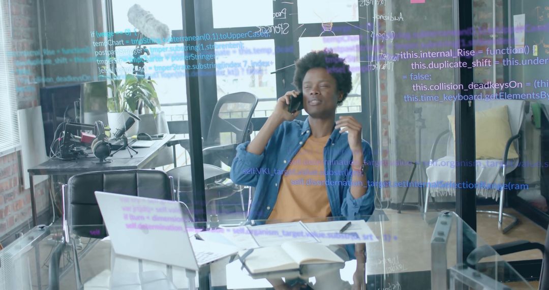 Tech Professional Managing Workload in Modern Office Environment