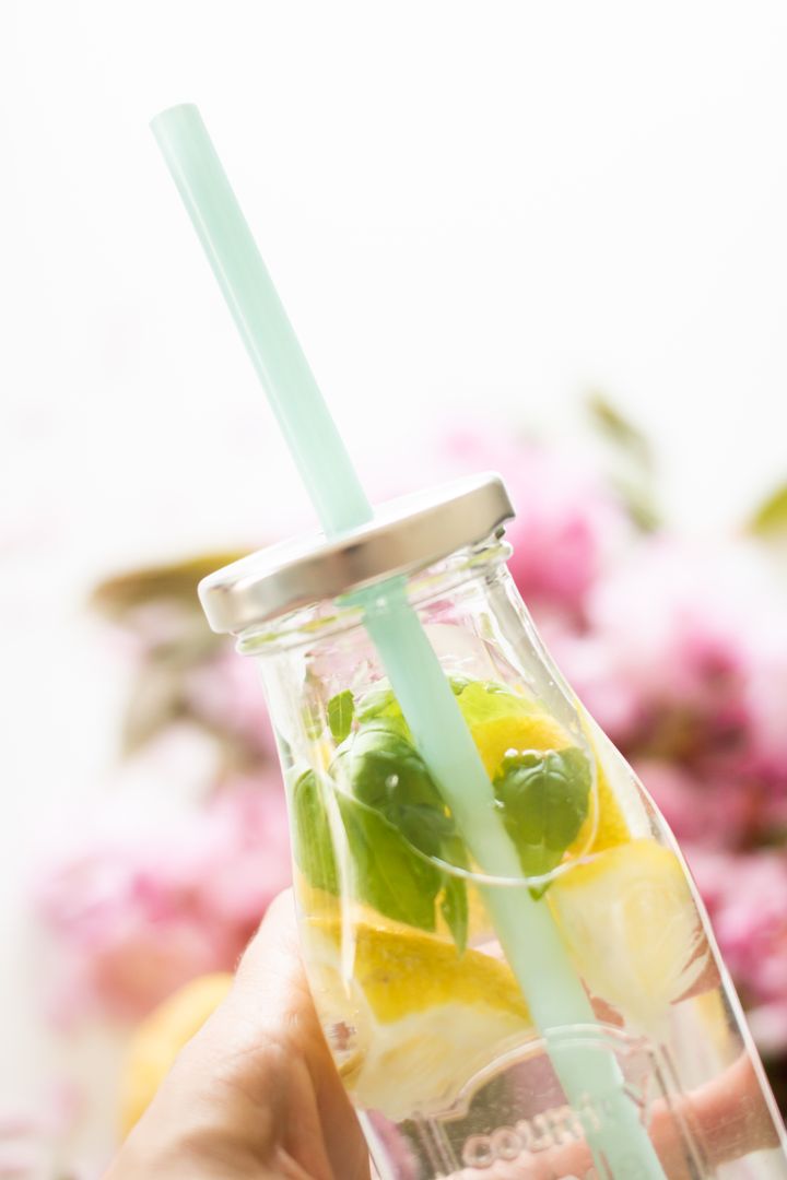 Refreshing Infused Water in Glass Bottle with Mint and Lemon