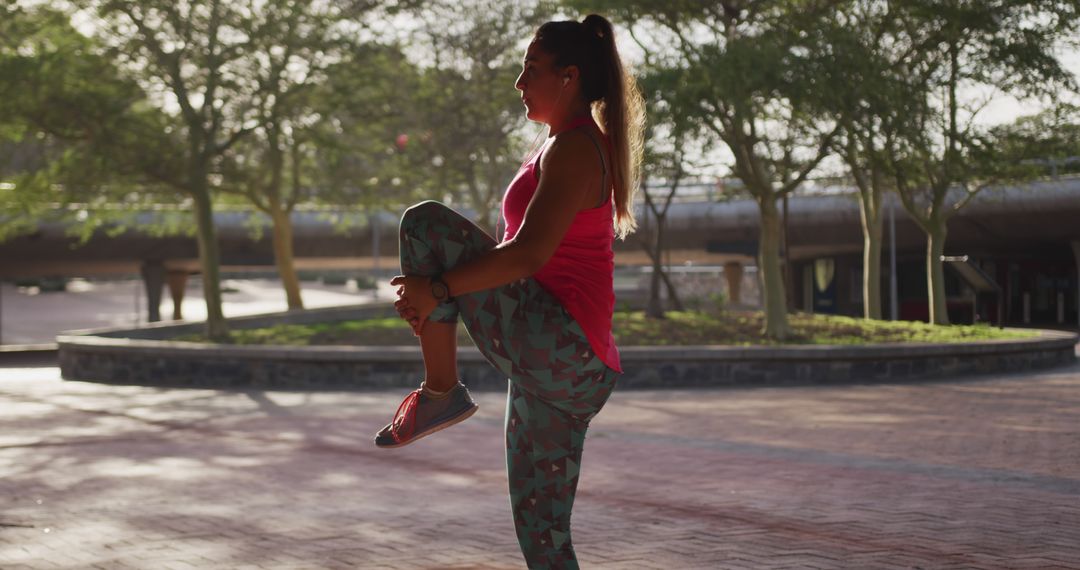 Woman Stretching in Park at Sunset - Free Images, Stock Photos and Pictures on Pikwizard.com