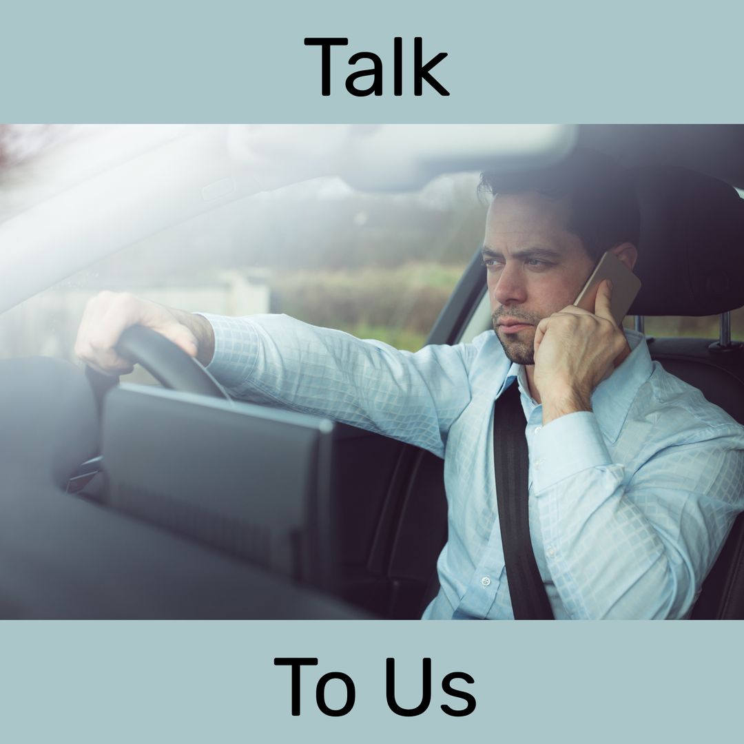 Businessman Driving Car While Speaking on Smartphone