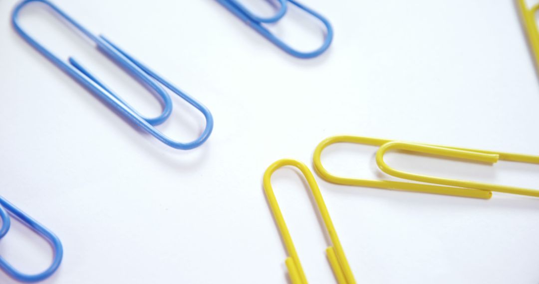 Close-Up of Colorful Paperclips on White Background - Free Images, Stock Photos and Pictures on Pikwizard.com