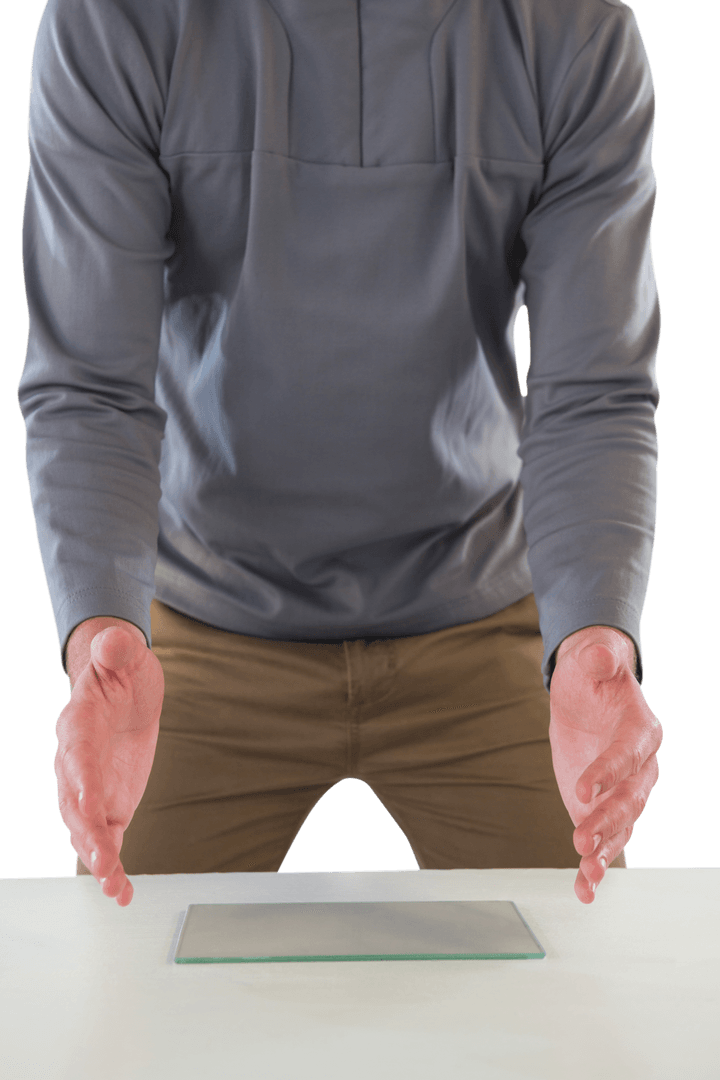 Businessman Gesturing Over Transparent Glass at Table