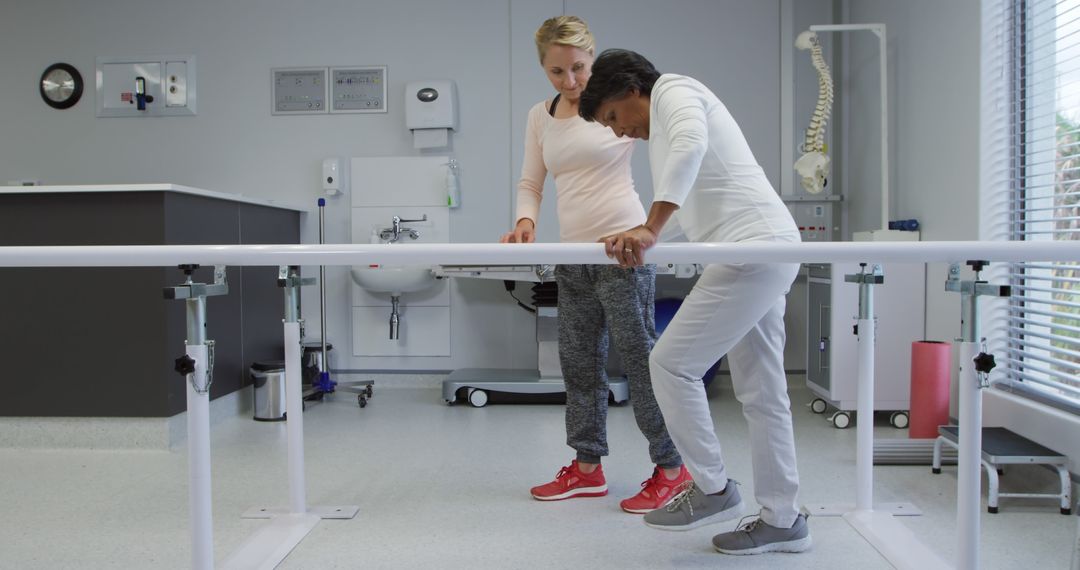 Physiotherapist Assisting Woman with Rehabilitation Exercises - Free Images, Stock Photos and Pictures on Pikwizard.com