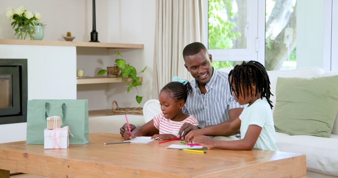 Father Engaging with Children in Creative Art Session at Home