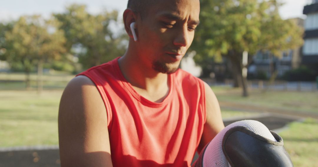 Biracial man exercising at gym outdoors with his prosthetic leg in park - Free Images, Stock Photos and Pictures on Pikwizard.com