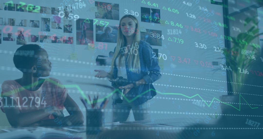 Colleagues Discuss Financial Data with Digital Overlay